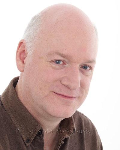 Headshot of actor James Head